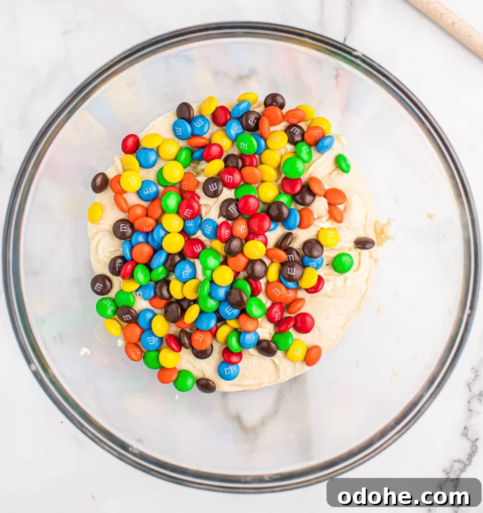 Chewy Cookies Made from White Cake Mix 5 adding m&m's to the cookie batter