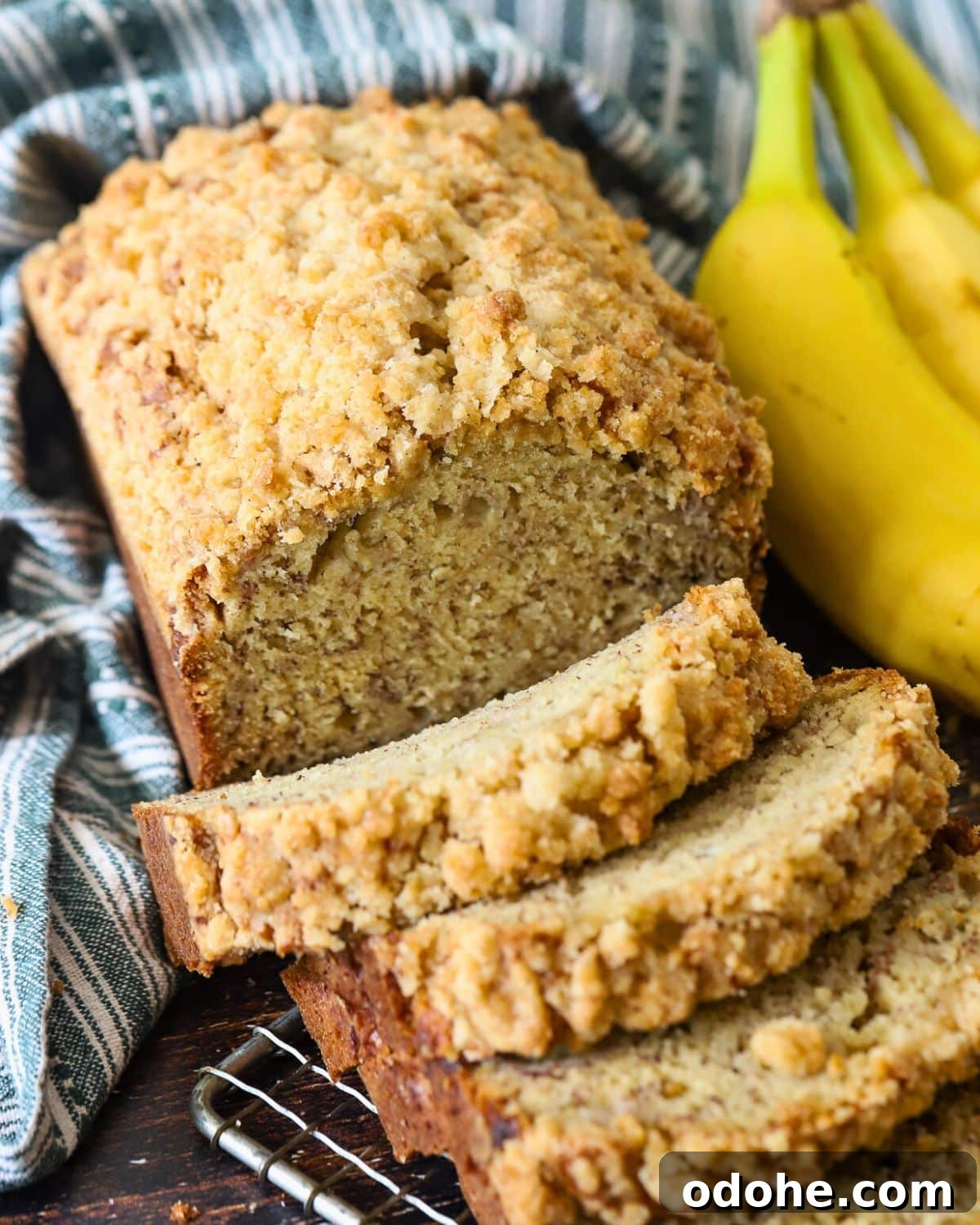 How to Store and Freeze Banana Bread for Maximum Freshness 2 A loaf of banana bread cut into slices for freezing.