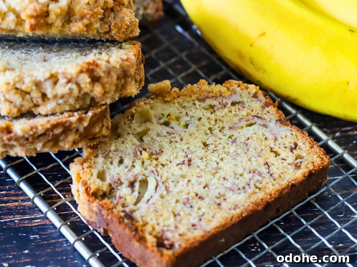 How to Store and Freeze Banana Bread for Maximum Freshness 3 A slice of banana bread on a cooling rack.