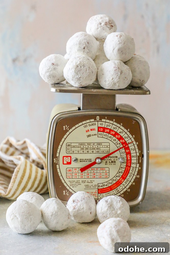 powdered sugar donut holes on a home scale
