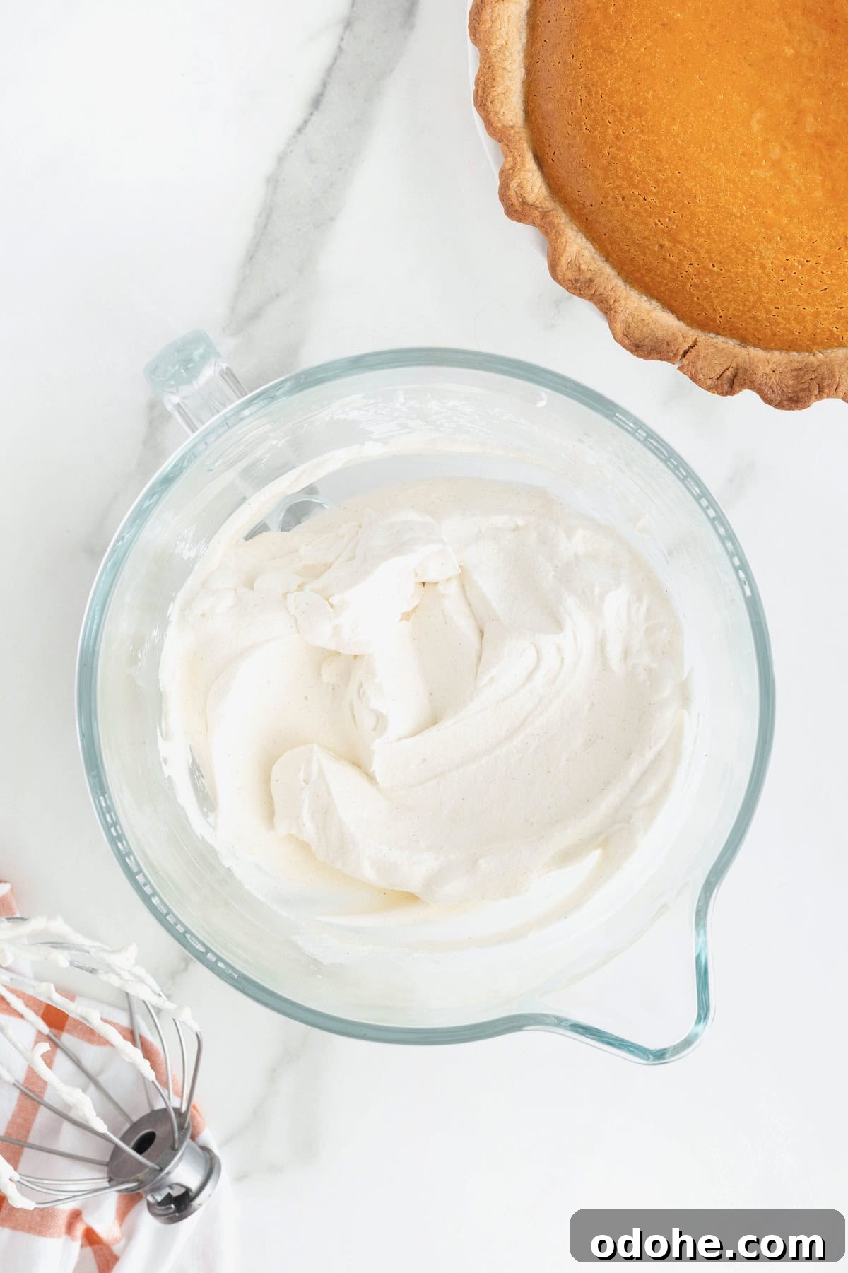 Creamy Pumpkin Pie Recipe: Classic Autumn Dessert Guide 12 Cream for a pumpkin cream pie in a large glass mixing bowl.