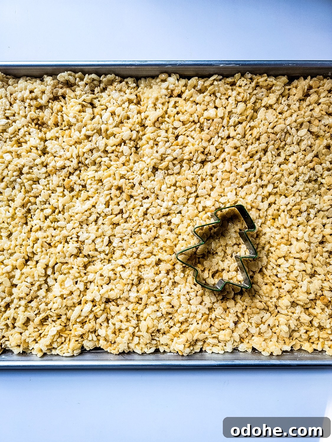 christmas tree cookie cutter on rice Krispy treats