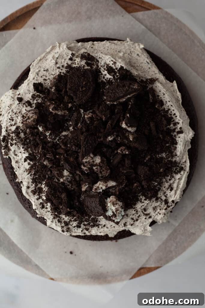 A chocolate cake frosted with oreo buttercream and crushed oreos on top