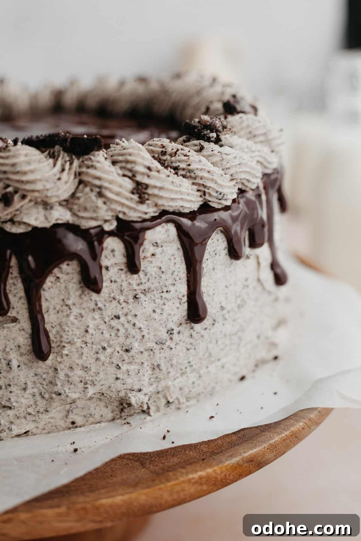 A close up of an oreo drip cake