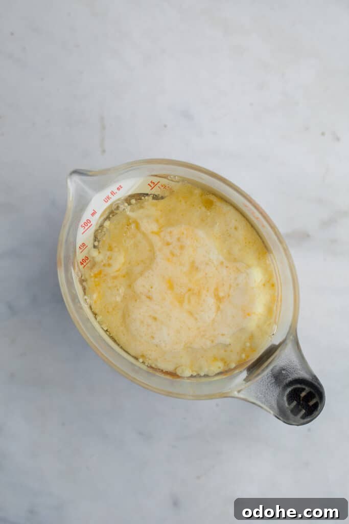 A measuring jug with milk and eggs whisked together