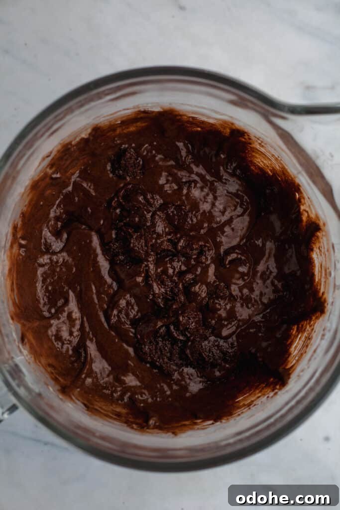 chocolate cake batter in a glass bowl