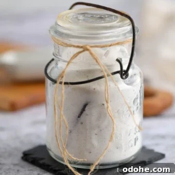 An old glass jar filled with Homemade Vanilla Sugar