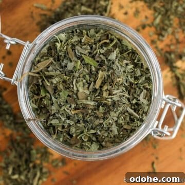 Dried basil in a glass crock.