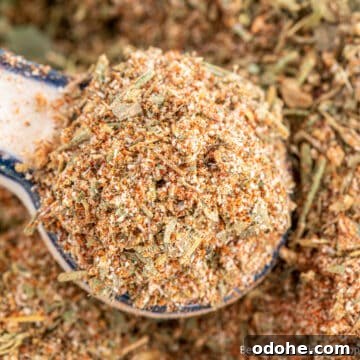 A teaspoon overfilled with a spice blend.