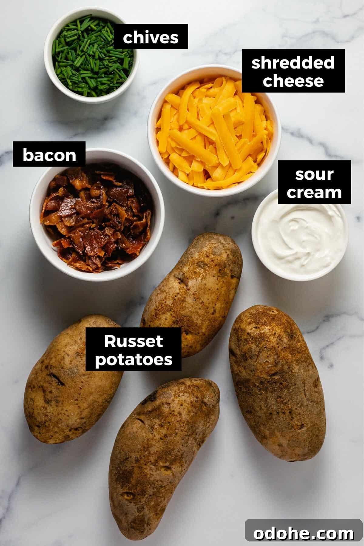 White marble counter top with ingredients to make instant pot baked potatoes