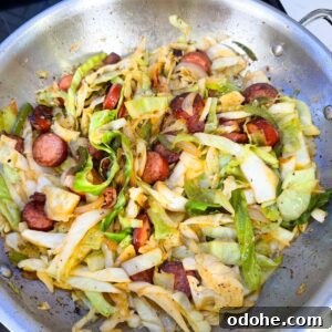 Cabbage in a pan with sausage.