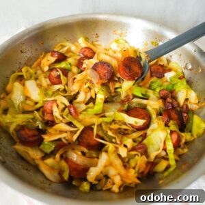 Southern fried cabbage with bacon, sausage, and onions, cooked until tender and full of Cajun flavor.