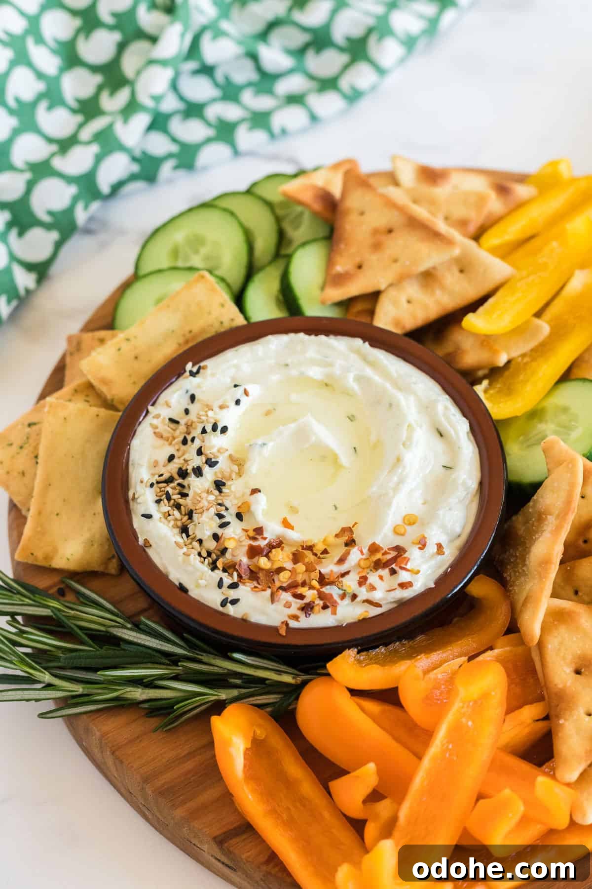 Creamy Whipped Feta Dip Recipe for Parties and Appetizers 2 bowl of feta dip with veggies on a wood platter