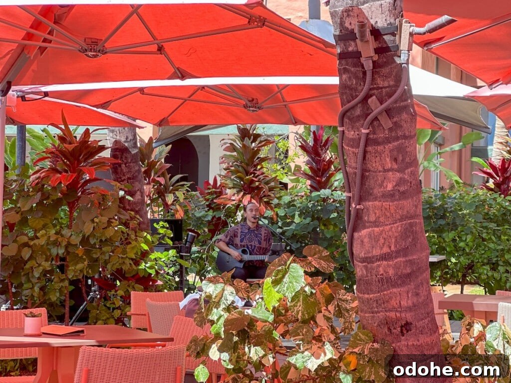 Live music under the pink umbrellas at The Royal Hawaiian resort in Waikīkī.