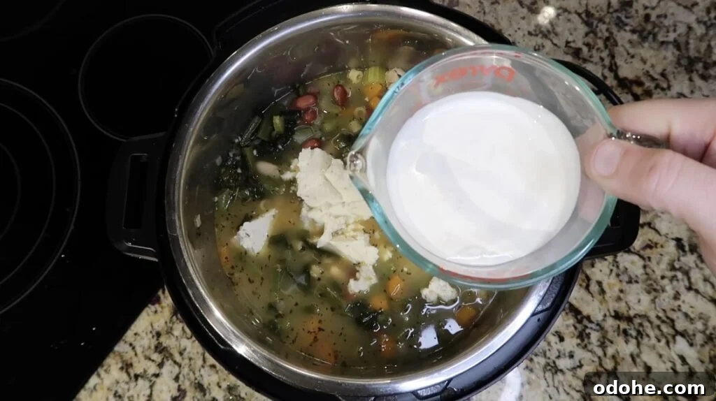 Adding cream to soup