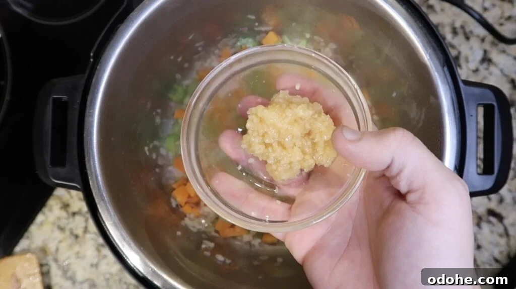 Adding garlic to pot