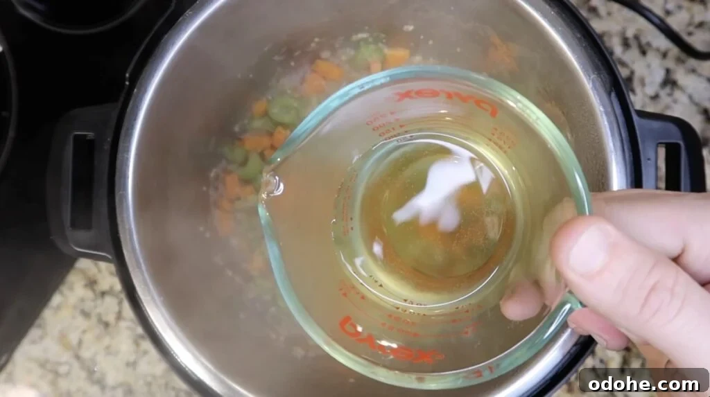 Adding white wine to pot
