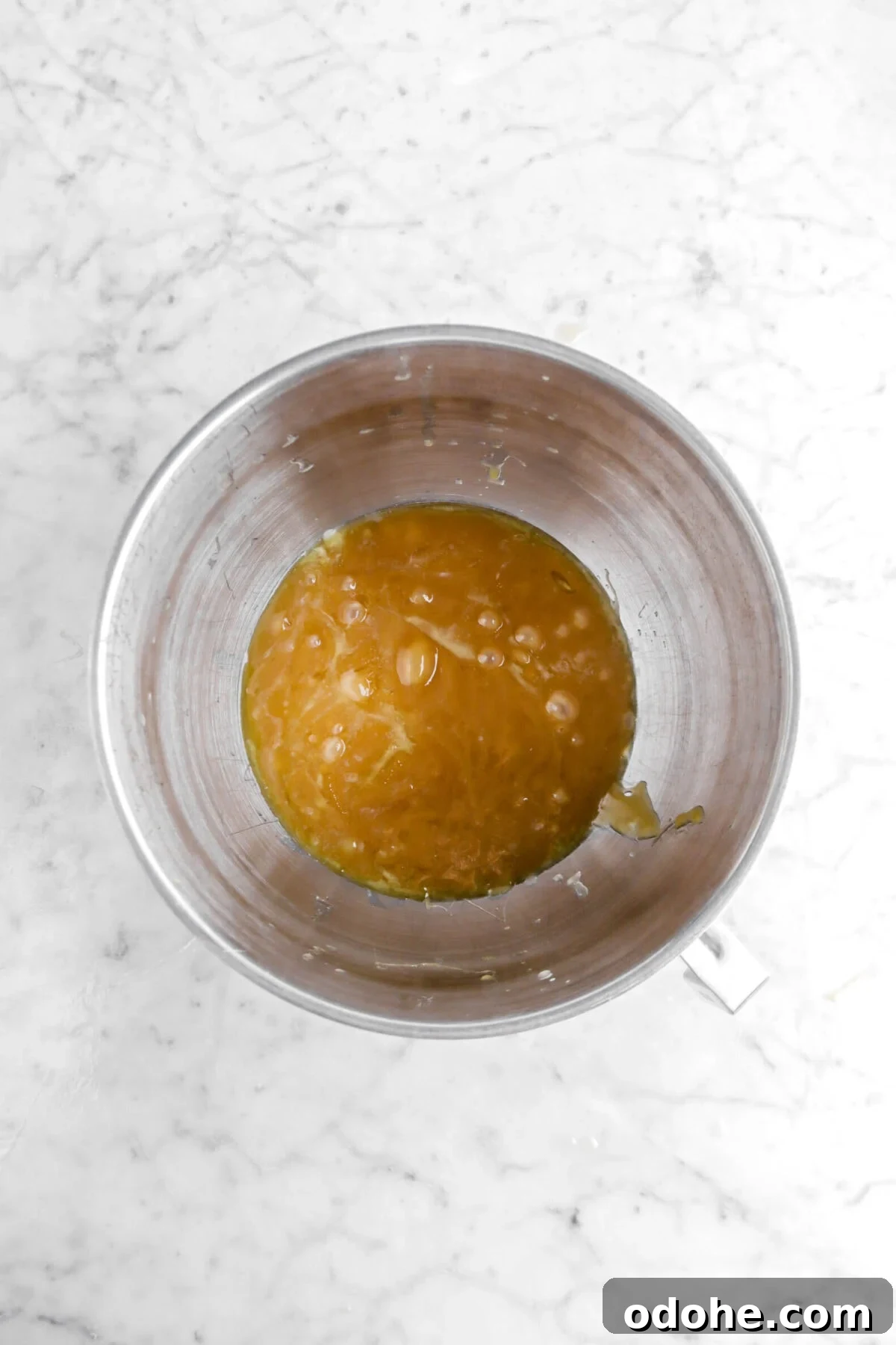 caramel and melted butter in mixer bowl.