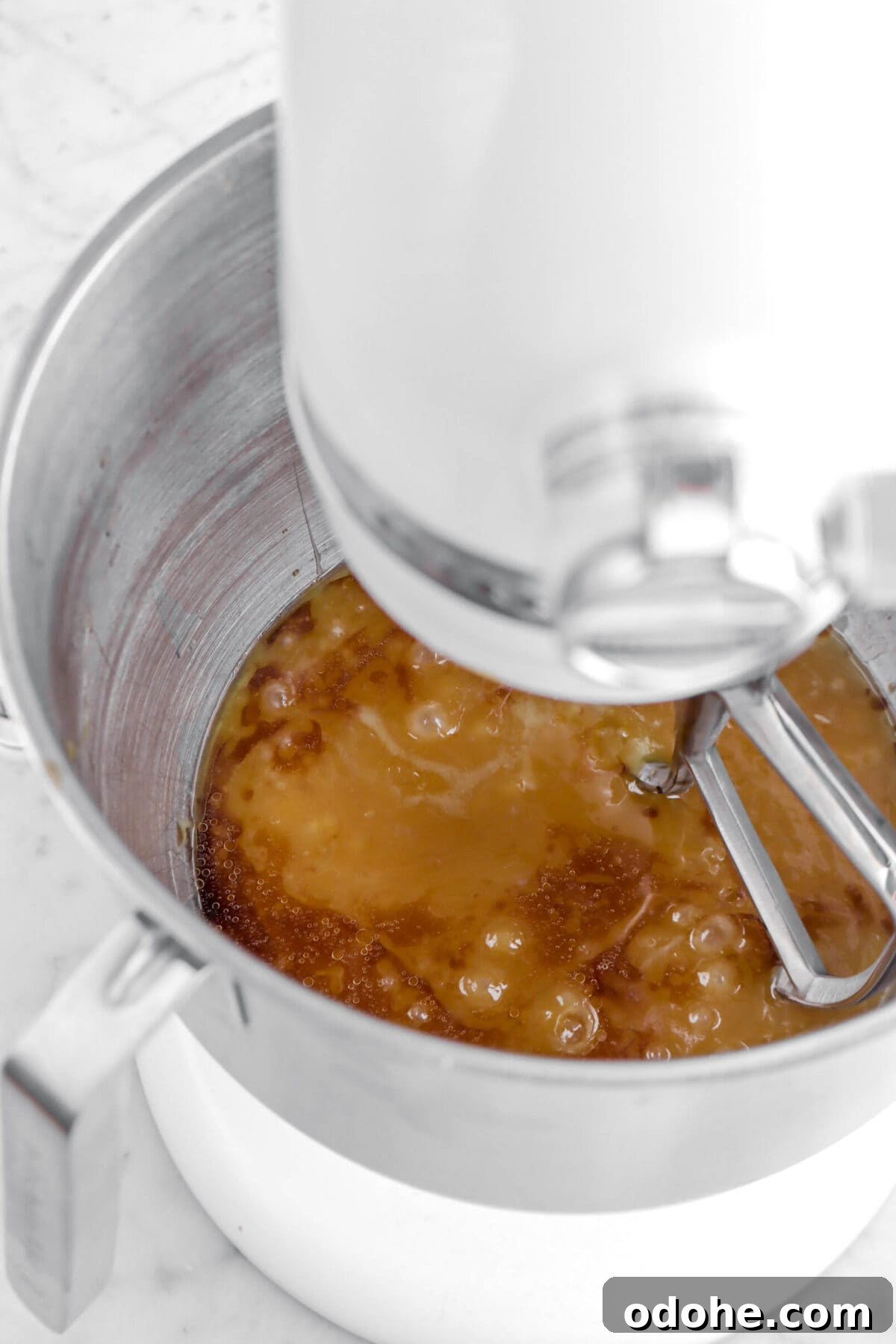 caramel and vanilla in stand mixer.