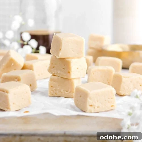 stacked maple fudge on upside down sheet pan.