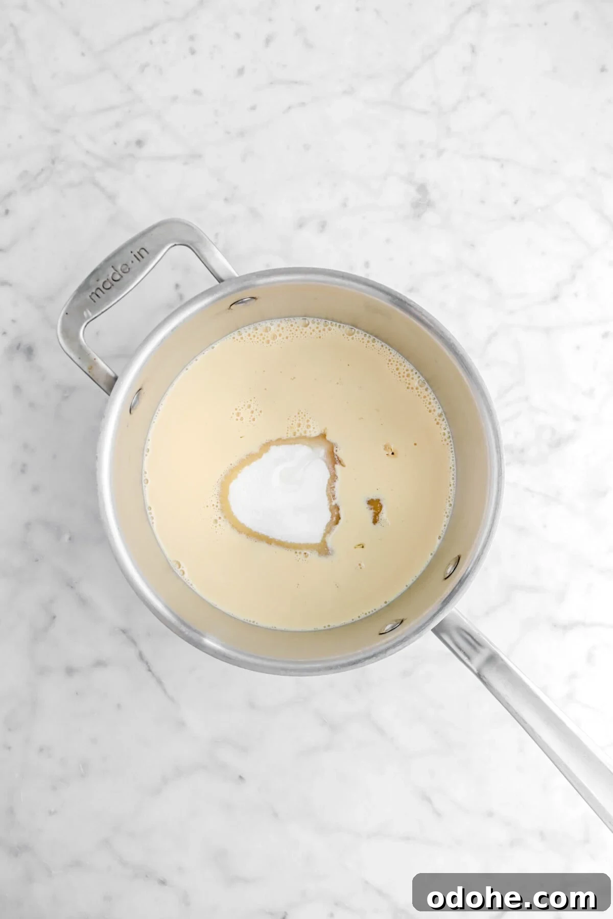 Evaporated milk, sugar, and maple syrup in large pot.