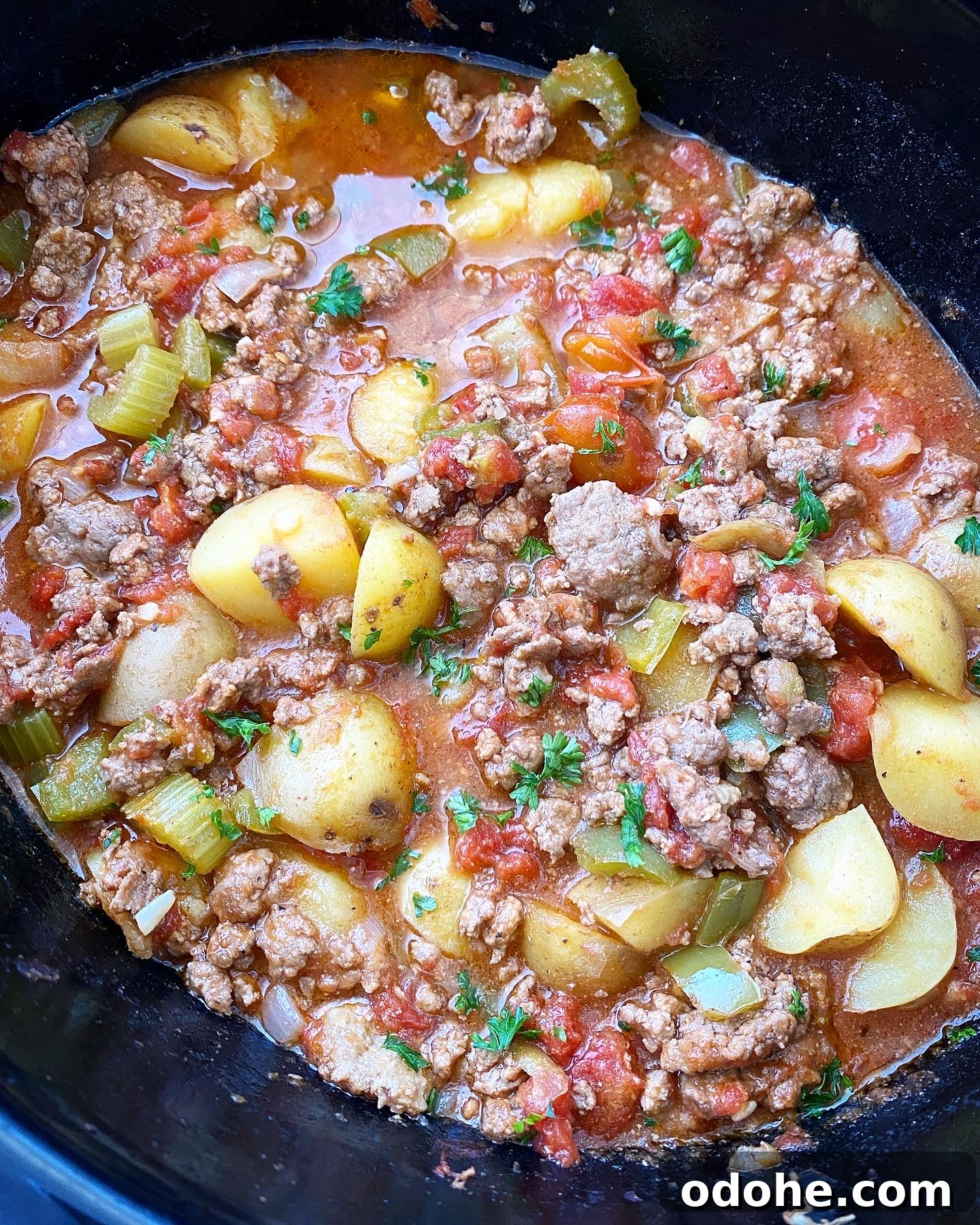 Slow Cooker Hamburger Stew Recipe — Hearty One-Pot Comfort Meal 6 side shot of cooked hamburger stew in the slow cooker