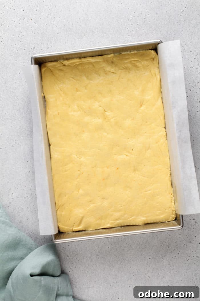Base for gooey butter cake pressed into the bottom of a cake pan.