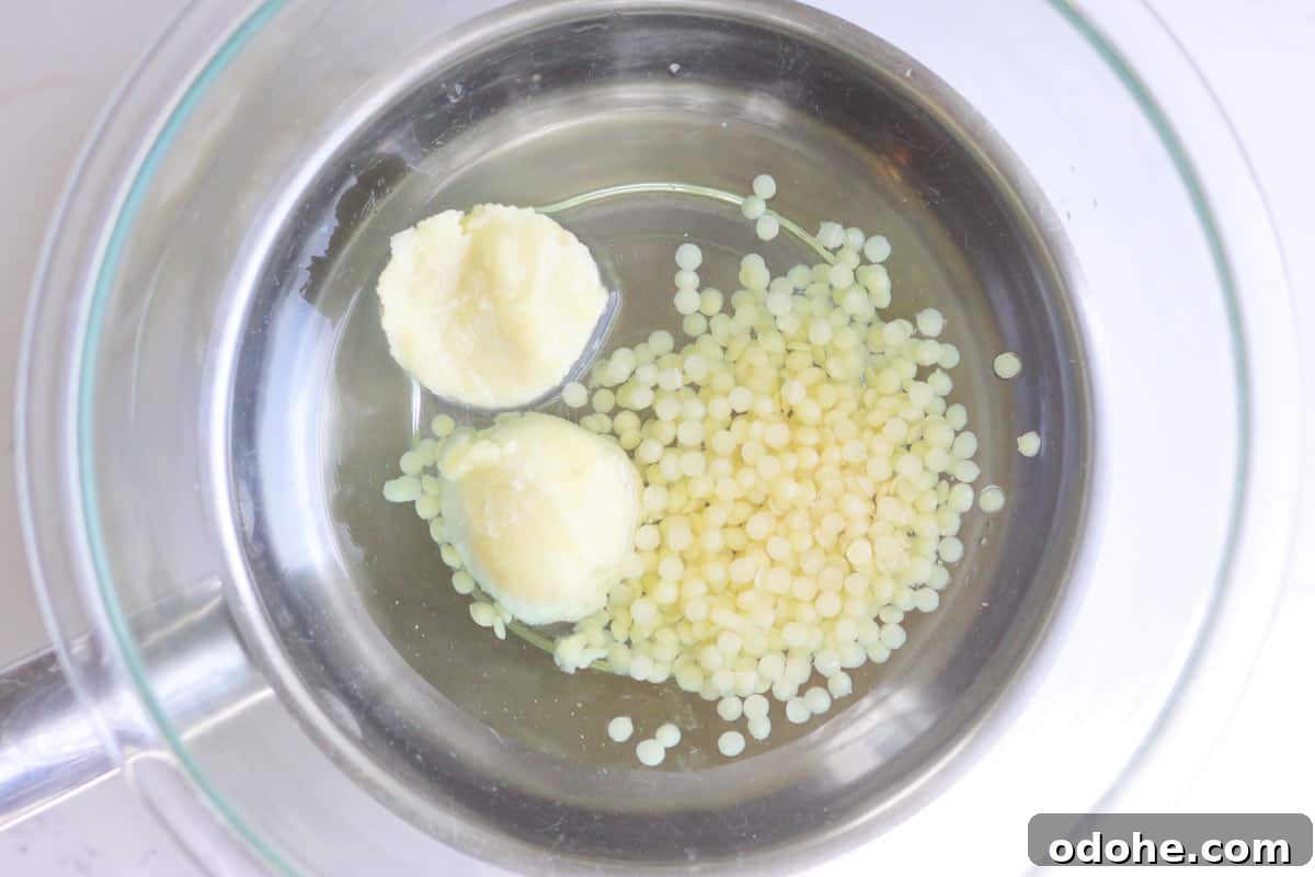 DIY Beeswax Leather Conditioner & Polish: Step-by-Step Guide 3 beeswax pellets, shea butter and jojoba oil in a pan together