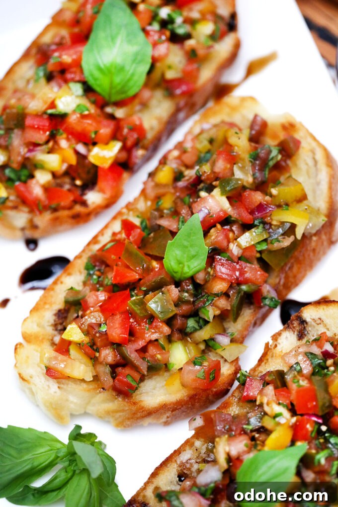 Authentic Italian Tomato Bruschetta Recipe for Summer Gatherings 4 Picture of Italian tomato bruschetta on a plate.