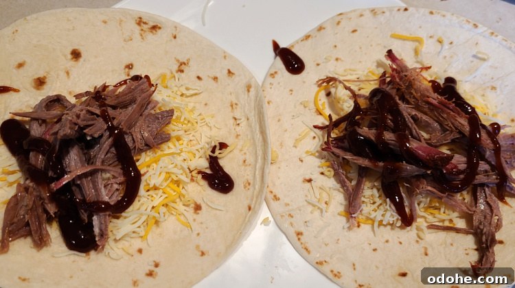Flour tortilla with shredded brisket, shredded cheese and bbq sauce.