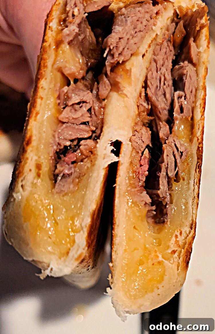 Cooked Brisket Quesadilla cut in half stacked