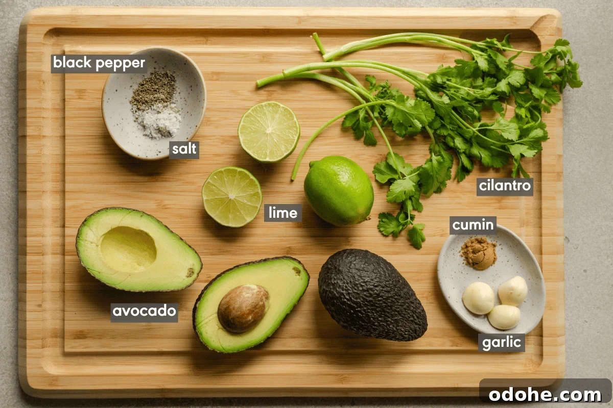 ingredients for simple guacamole on a wooden cutting board.