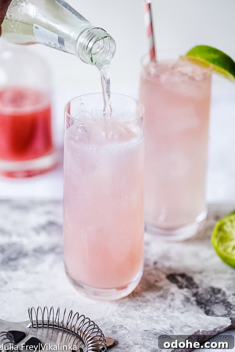 Rhubarb Moscow Mule in a glass being topped with sparkling drink
