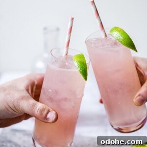Two glasses of Rhubarb Moscow Mule brought together in toast