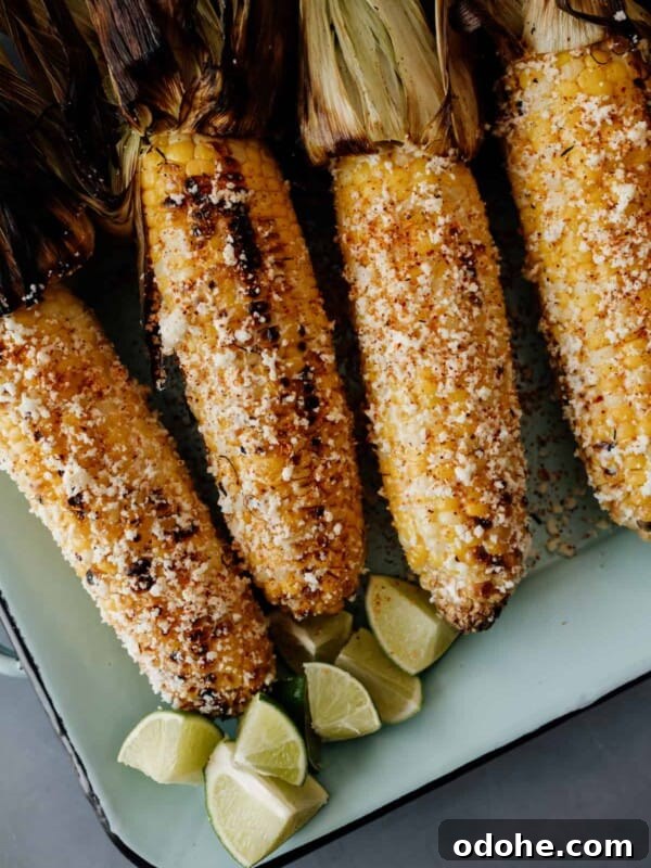 4 pieces of Mexican street corn on a serving platter