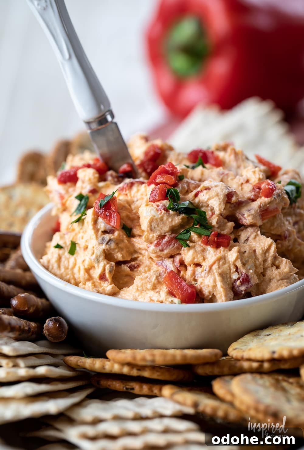 Smoky Roasted Red Pepper Dip Recipe 2 roasted red pepper dip in a bowl with crackers.