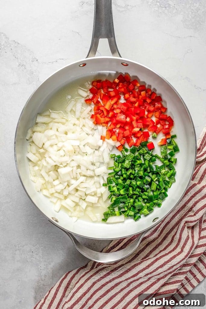 Creamy Shrimp Enchiladas Recipe 6 onion, bell pepper, and poblano pepper on a skillet