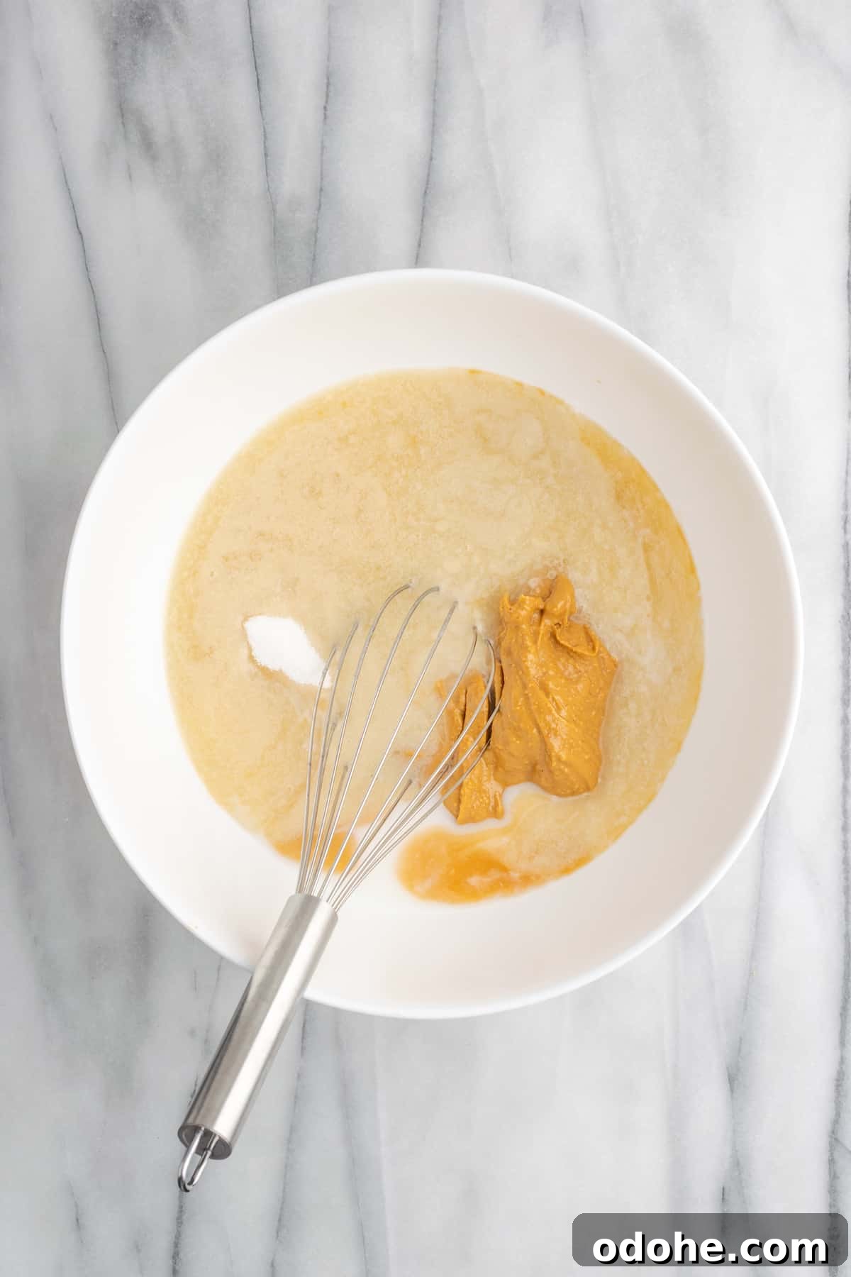 This delicious vegan peanut butter cake recipe is quick and easy to make, bursting with flavor, and the perfect treat with coffee or ice cream A bowl of peanut butter frosting ingredients