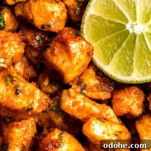 Cilantro Lime Chicken Bites for Air Fryer: Quick & Flavorful 11 close up image of air fryer cilantro lime chicken bites and lime wedge