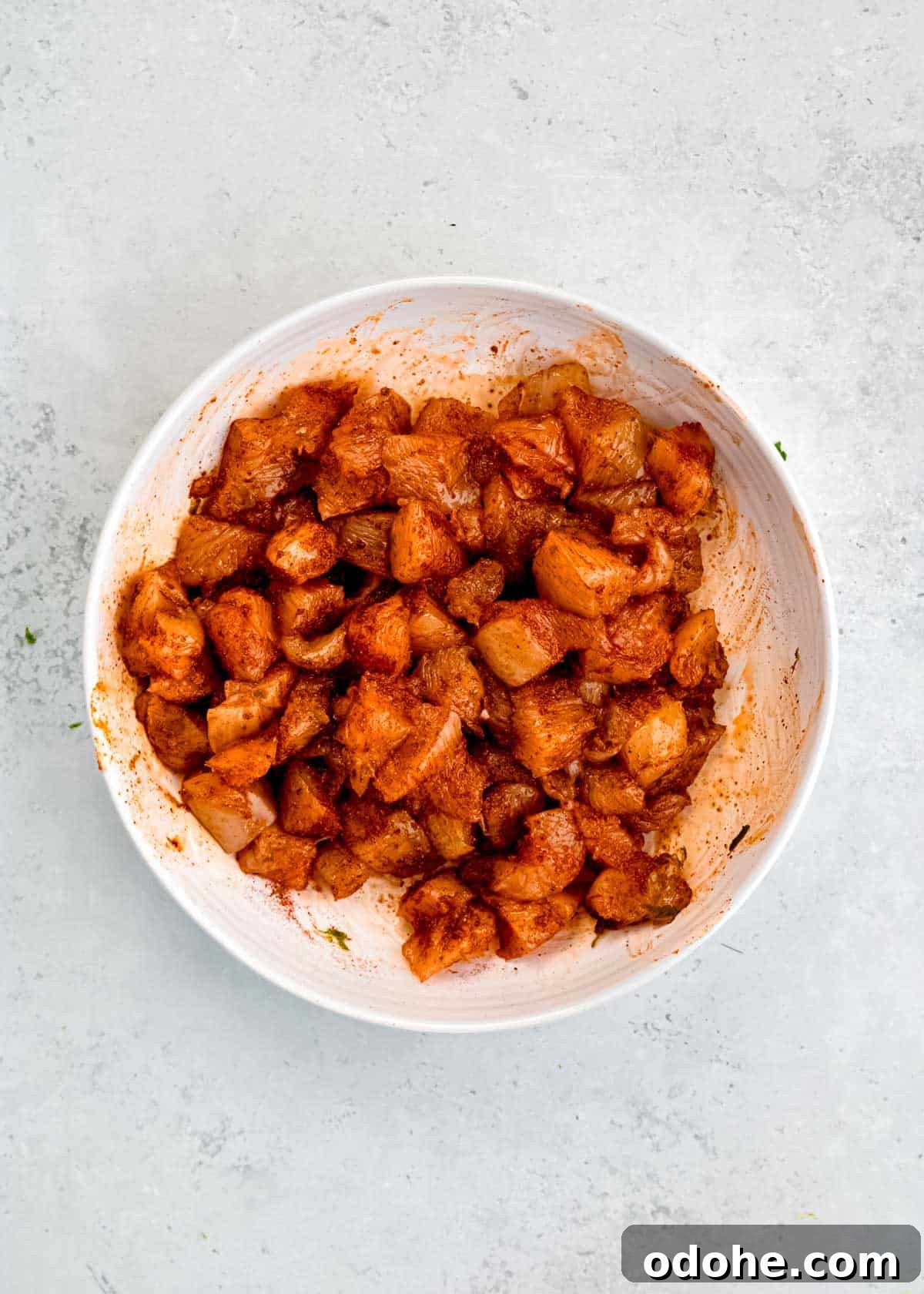 Cilantro Lime Chicken Bites for Air Fryer: Quick & Flavorful 5 seasoned raw chicken bites in white mixing bowl