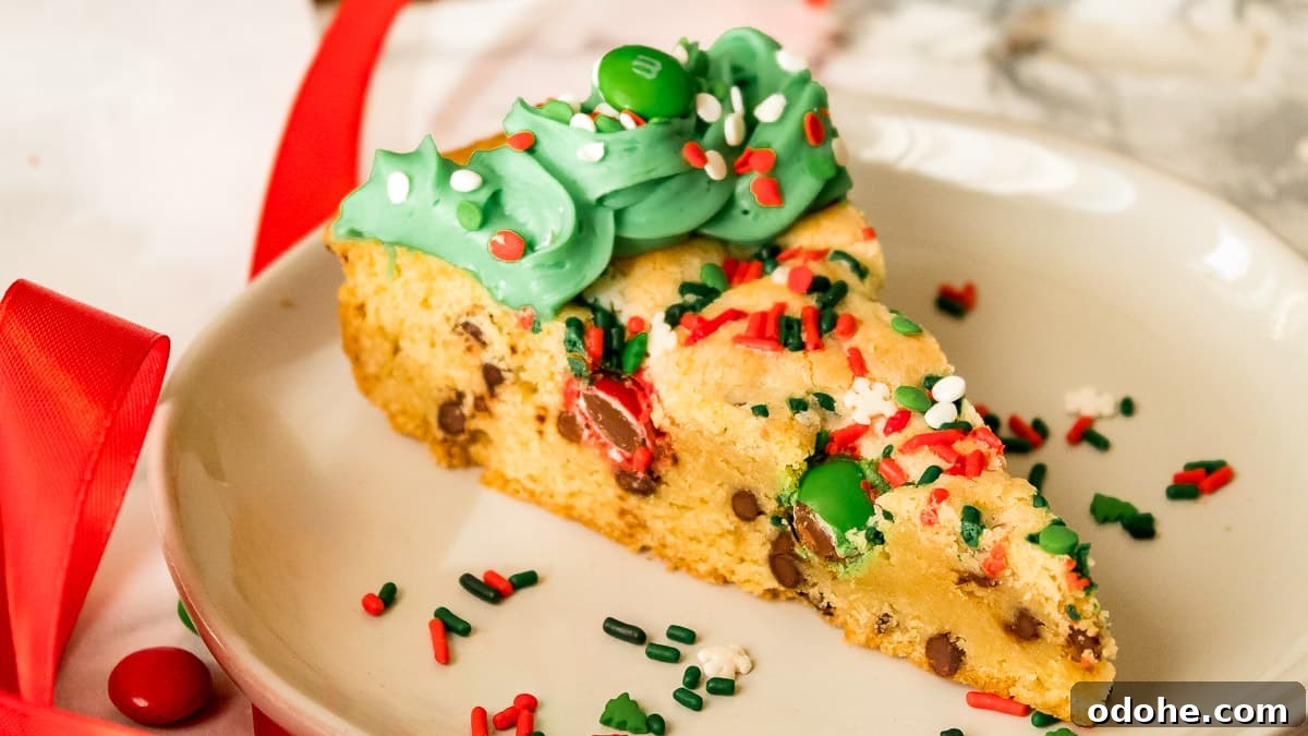 Festive Christmas Cookie Cake Recipe for Holiday Parties 7 slice of cookie cake on a plate