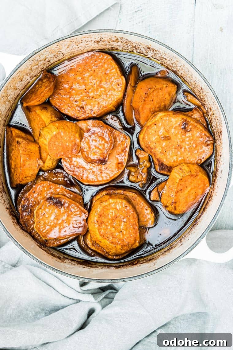 Southern Candied Sweet Potatoes with Brown Sugar and Pecans 2 candied sweet potatoes in a large dish