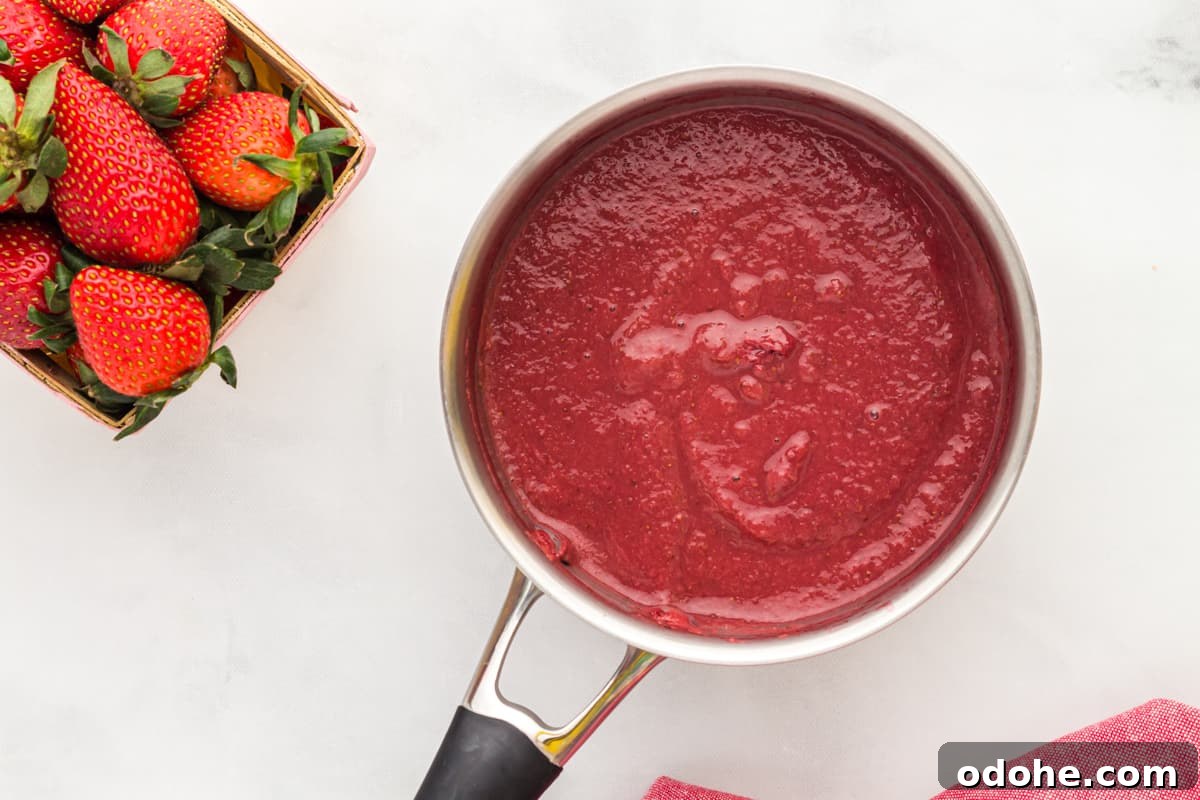 Moist Strawberry Sheet Cake Recipe for Parties and Potlucks 6 strawberry reduction in a saucepan.