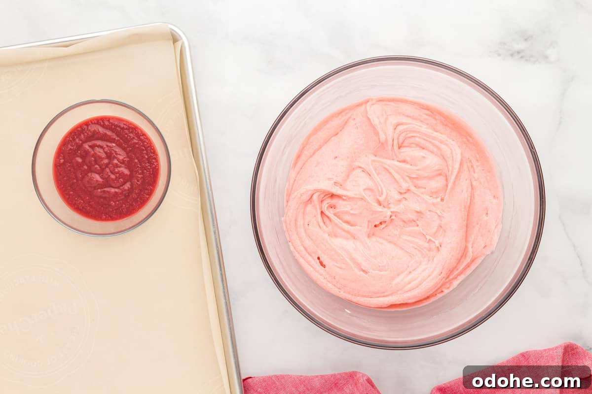 Moist Strawberry Sheet Cake Recipe for Parties and Potlucks 10 a bowl of strawberry cake batter next to a bowl of strawberry reduction.