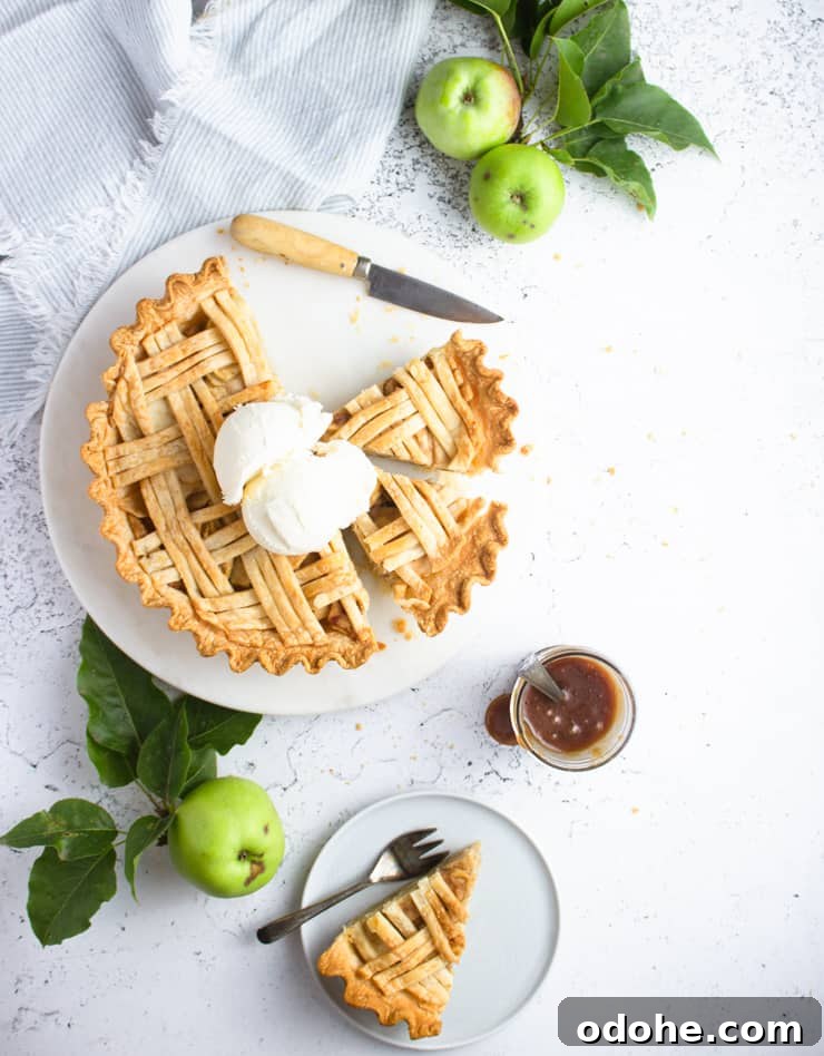 baked apple pie with ice cream on top
