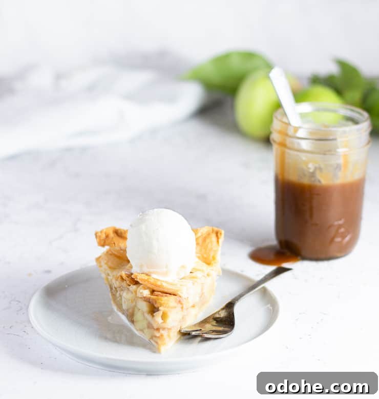 slice of apple pie in front of jar of butterscotch