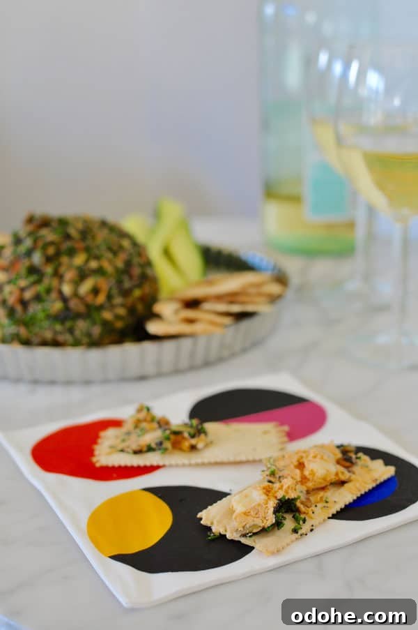 This manchego chipotle cheese ball is perfect for parties; coated with pumpkin and poppy seeds, and chives its a real crowd pleaser. Gluten-free! Manchego Pumpkin Seed Cheese Ball