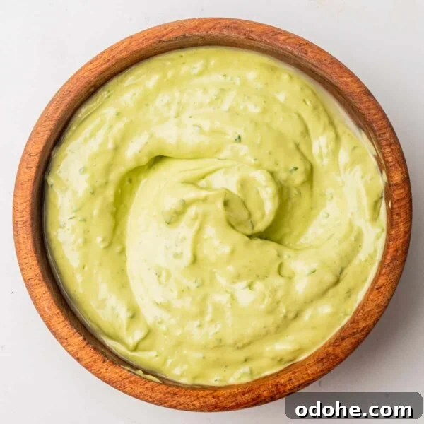 An overhead image of avocado cilantro lime dressing in a bowl.