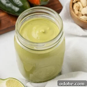 A close up image of poblano sauce in a mason jar.