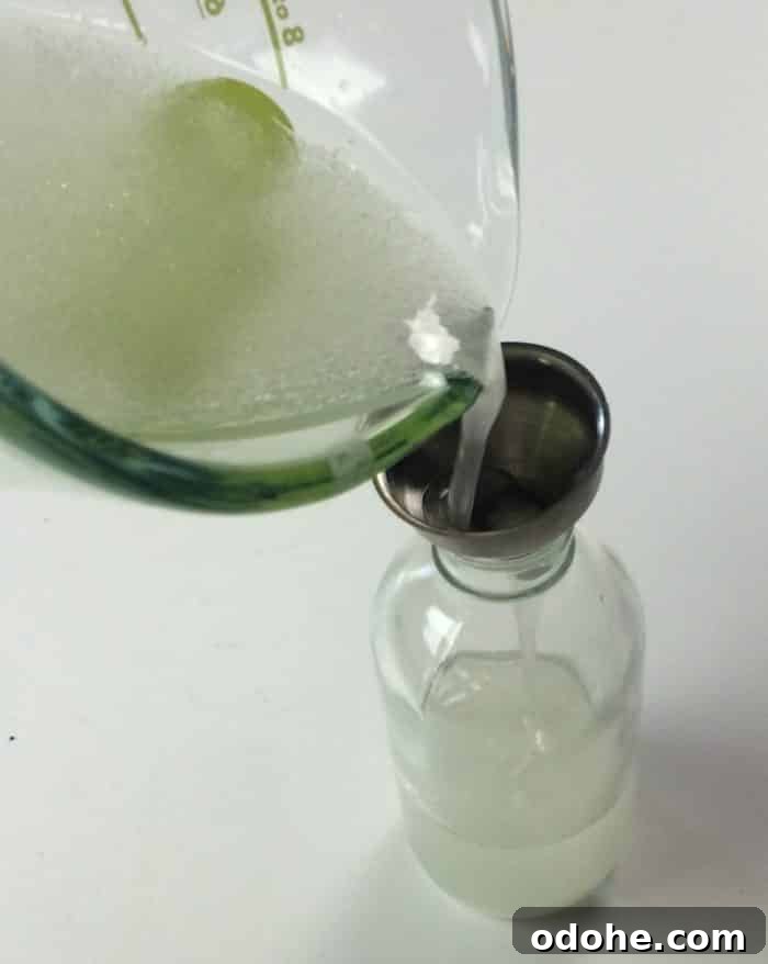 pouring into spray bottle
